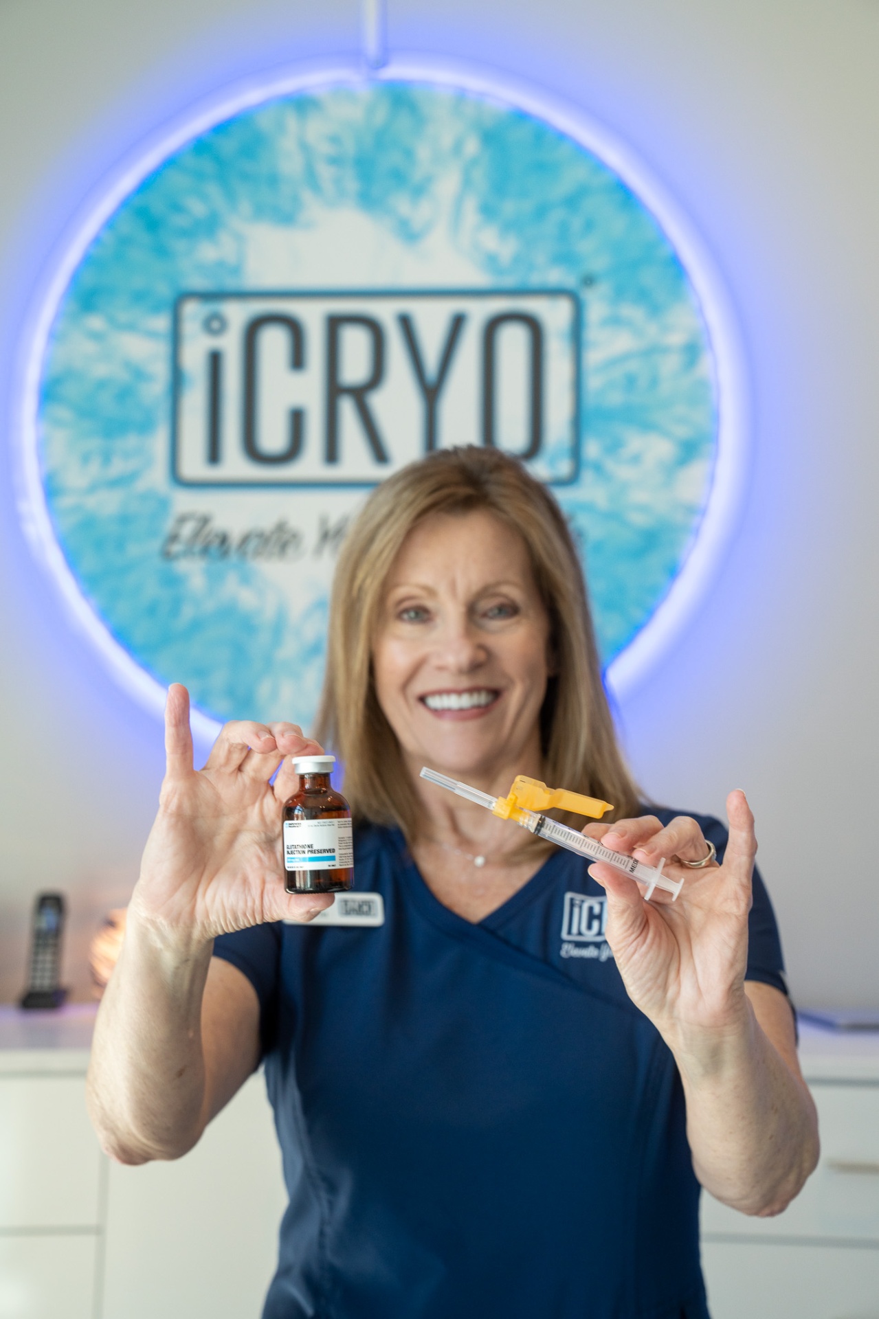 iCRYO Guilderland registered nurse holding glutathione IM shot vial and syringe