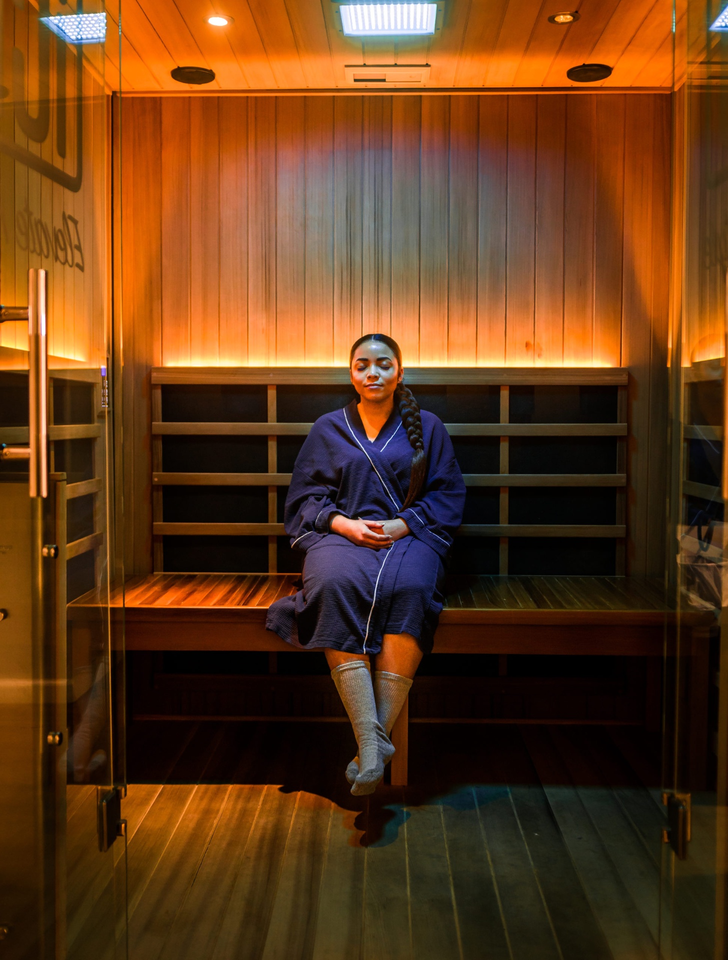 Guest sweating during deep detox infrared sauna session at iCRYO Guilderland